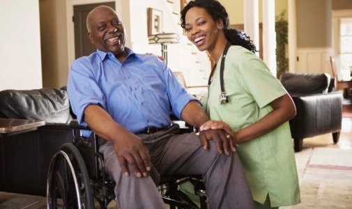 Man in wheelchair with nurse
